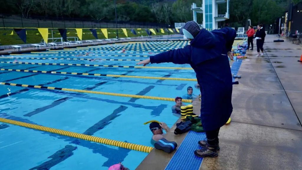 Stroke clinic in session—full-time, certified coaches working directly with swimmers to refine technique and build efficiency in the water. No shortcuts. Just focused, personalized instruction.